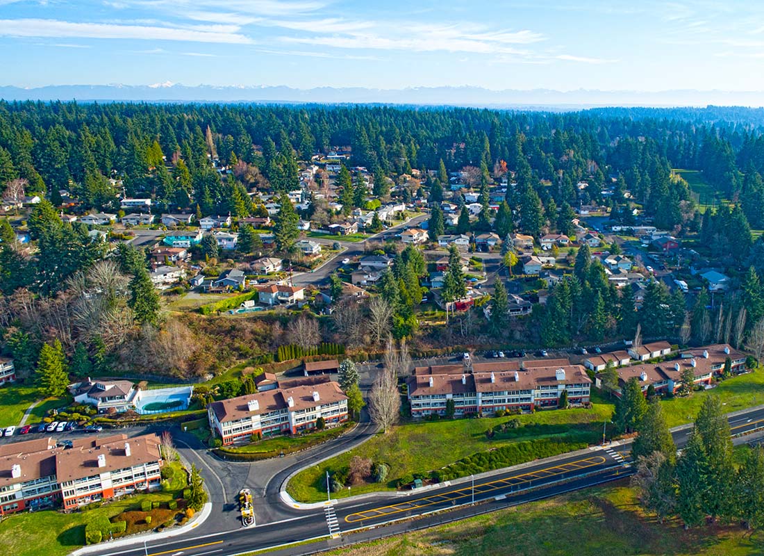 Mountlake Terrace, WA - Aerial View of Homes Surrounded by Green Grass and Green Trees in Mountlake Terrace Washington on a Beautiful Sunny Day
